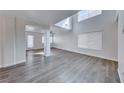 Airy open-concept living space with soaring ceilings and stylish hardwood flooring at 11028 Meadow Leaf Ave, Las Vegas, NV 89144