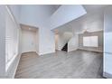 Bright living room with soaring ceilings, new floors, and abundant natural light at 11028 Meadow Leaf Ave, Las Vegas, NV 89144