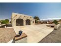 View of garage and long driveway with circular turnaround at 1320 Daytona St, Pahrump, NV 89048