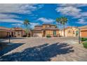 Charming single-Gathering home with desert landscaping, paver driveway, and two-car garage at 153 Via Di Mello, Henderson, NV 89011