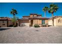 Charming single-Gathering home with desert landscaping, paver driveway, and two-car garage at 153 Via Di Mello, Henderson, NV 89011