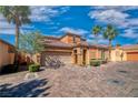 Charming single-Gathering home with desert landscaping, paver driveway, and two-car garage at 153 Via Di Mello, Henderson, NV 89011