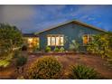 Night exterior shot of the front of the home featuring desert landscaping and bay window at 1601 Eaton Dr, Las Vegas, NV 89102