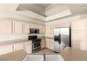 Well-equipped kitchen featuring stainless steel appliances, ample cabinetry, and a center island at 199 Bailey Island Dr, Henderson, NV 89074