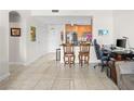 Open living area with tile flooring, a kitchen, and neutral paint at 200 W Sahara Ave # 1703, Las Vegas, NV 89102