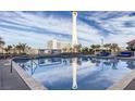 Rooftop pool with Stratosphere view and patio furniture at 200 W Sahara Ave # 1703, Las Vegas, NV 89102