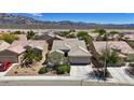 A view of the house showcasing the landscape and mountain views at 2108 Willow Wren Dr, North Las Vegas, NV 89084