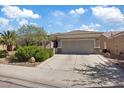 Beautiful single-story home with a two-car garage, desert landscaping and a tile roof at 2108 Willow Wren Dr, North Las Vegas, NV 89084