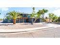 Wide view of home featuring desert landscaping, balcony, and two-car garage at 2180 Palora Ave, Las Vegas, NV 89169