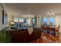 Well-lit living room with hardwood floors, balcony, and adjacent dining area at 2777 Paradise Rd # 1105, Las Vegas, NV 89109