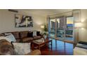 Cozy living room with comfortable seating and views of the city skyline from the balcony at 2777 Paradise Rd # 1105, Las Vegas, NV 89109