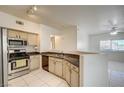 Traditional kitchen with stainless steel appliances open to the living area at 3400 Cabana Dr # 1068, Las Vegas, NV 89122