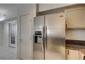 The kitchen features a stainless steel refrigerator with marble countertops at 3400 Cabana Dr # 1068, Las Vegas, NV 89122