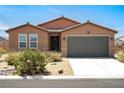 Charming single-story house with a well-maintained front yard and a two-car garage at 3543 E Malheur Ave, Pahrump, NV 89061