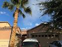 Single-Gathering home featuring desert landscaping and a tall palm tree at 3928 Ropers Ranch St, North Las Vegas, NV 89032