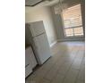 Dining area with tiled flooring, a window with blinds, and a modern chandelier at 4300 N Lamont St # 249, Las Vegas, NV 89115