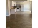 Open-concept kitchen featuring a white refrigerator, stove, microwave, and light countertops at 4300 N Lamont St # 249, Las Vegas, NV 89115