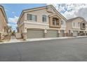 Charming two-story home with a three-car garage and neutral stucco exterior at 4521 Bell Cord Ave # 103, North Las Vegas, NV 89031