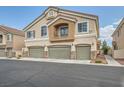 Charming two-story home with a three-car garage and neutral stucco exterior at 4521 Bell Cord Ave # 103, North Las Vegas, NV 89031