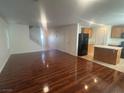 Open concept living space with new floors, seamlessly connecting the living area and kitchen at 523 Cabis Bay St, Las Vegas, NV 89178