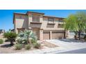 Beautiful two-story home with lush landscaping, two-car garage, and a well-maintained exterior at 54 Blue Fountain Ct, Henderson, NV 89012