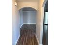 Hallway features an arched entrance and sleek, modern wood-look floors at 541 Indian Bluff St # 201, Las Vegas, NV 89145