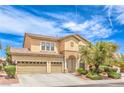 Charming two-story home featuring a well-maintained yard, arched entry and a spacious two-car garage at 5862 Bluthe Bridge Ave, Las Vegas, NV 89141