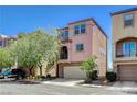 Two-story home featuring a stucco facade, two-car garage, and well-maintained front yard at 6622 Colorado Spruce St, Las Vegas, NV 89149