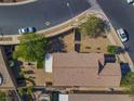 Bird's-eye view of a home with a tile roof, landscaped backyard, and a covered patio at 711 Golden Sedum Dr, Henderson, NV 89011