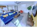 Cozy living room featuring open floor plan and staircase, seamlessly connecting to kitchen and dining area at 7319 Burnt Umber St, Las Vegas, NV 89139