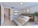Comfortable bedroom displaying neutral tones, ample natural light, and tasteful artwork for a relaxing atmosphere at 7885 W Flamingo Rd # 1016, Las Vegas, NV 89147