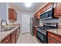 Efficient kitchen features stainless steel appliances, granite countertops, and wood cabinetry offering both style and functionality at 7885 W Flamingo Rd # 1016, Las Vegas, NV 89147