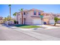Charming two-story home featuring desert landscaping, a two-car garage, and a tile roof at 8507 Titania Ct, Las Vegas, NV 89147