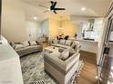 Bright living room featuring neutral furniture, modern decor, and an open floor plan at 8720 Prairie Hill Dr, Las Vegas, NV 89134