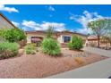 Inviting single-story home with desert landscaping and low-maintenance rock ground cover at 9142 Royal Monarch Ct, Las Vegas, NV 89147