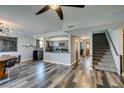 Dining area with stylish lighting, a chalkboard wall, and stairs leading to upper level at 100 Huntly Rd, Las Vegas, NV 89145