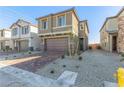 Delightful two-story home featuring a brick driveway and desert landscaping at 10328 Apefly St, Las Vegas, NV 89141