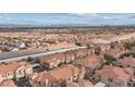 An aerial view captures this property near highways and the cityscape in the distance at 10550 W Alexander Rd # 2082, Las Vegas, NV 89129
