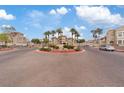 A well-manicured roundabout and entrance creates a welcoming atmosphere to the property at 10550 W Alexander Rd # 2082, Las Vegas, NV 89129