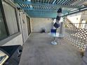 Wide patio with table, chairs, bbq and textured wall visible at 1128 Willow Tree Dr # C, Las Vegas, NV 89128