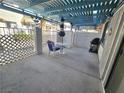 Outdoor patio space with pergola cover, table, chairs, and BBQ at 1128 Willow Tree Dr # C, Las Vegas, NV 89128