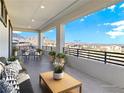 Relaxing balcony features comfortable seating with mountain views at 180 Native Stone St, Las Vegas, NV 89138