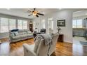 Spacious living room featuring hardwood floors, recessed lighting, and views into kitchen at 2114 High Mesa Dr, Henderson, NV 89012