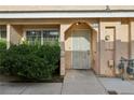 Cozy townhome entrance with security door and mature landscaping at 2123 Sleepy Ct, Las Vegas, NV 89106