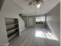 The living room features neutral walls, ceiling fan, and new vinyl plank flooring at 2123 Sleepy Ct, Las Vegas, NV 89106