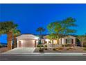 Charming single-story home featuring a two-car garage, well-manicured landscaping, and a welcoming entrance at 2319 Hardin Ridge Dr, Henderson, NV 89052