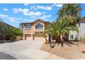 Charming two-story home with a well-maintained front yard and three-car garage, perfect for a Gathering at 395 Suzanne Peak Ct, Henderson, NV 89012