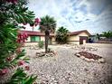 Charming single-story house featuring a low-maintenance desert landscape, palm trees, and a cozy curb appeal at 4881 E Imperial Ave, Las Vegas, NV 89104