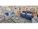 Cozy living room featuring hardwood floors, comfortable seating, and stylish decor at 5068 Rivedro St, Las Vegas, NV 89135