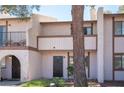 Exterior view of a two-story townhome featuring a quaint facade and inviting entryway at 5241 Janfred Ct # 18, Las Vegas, NV 89103